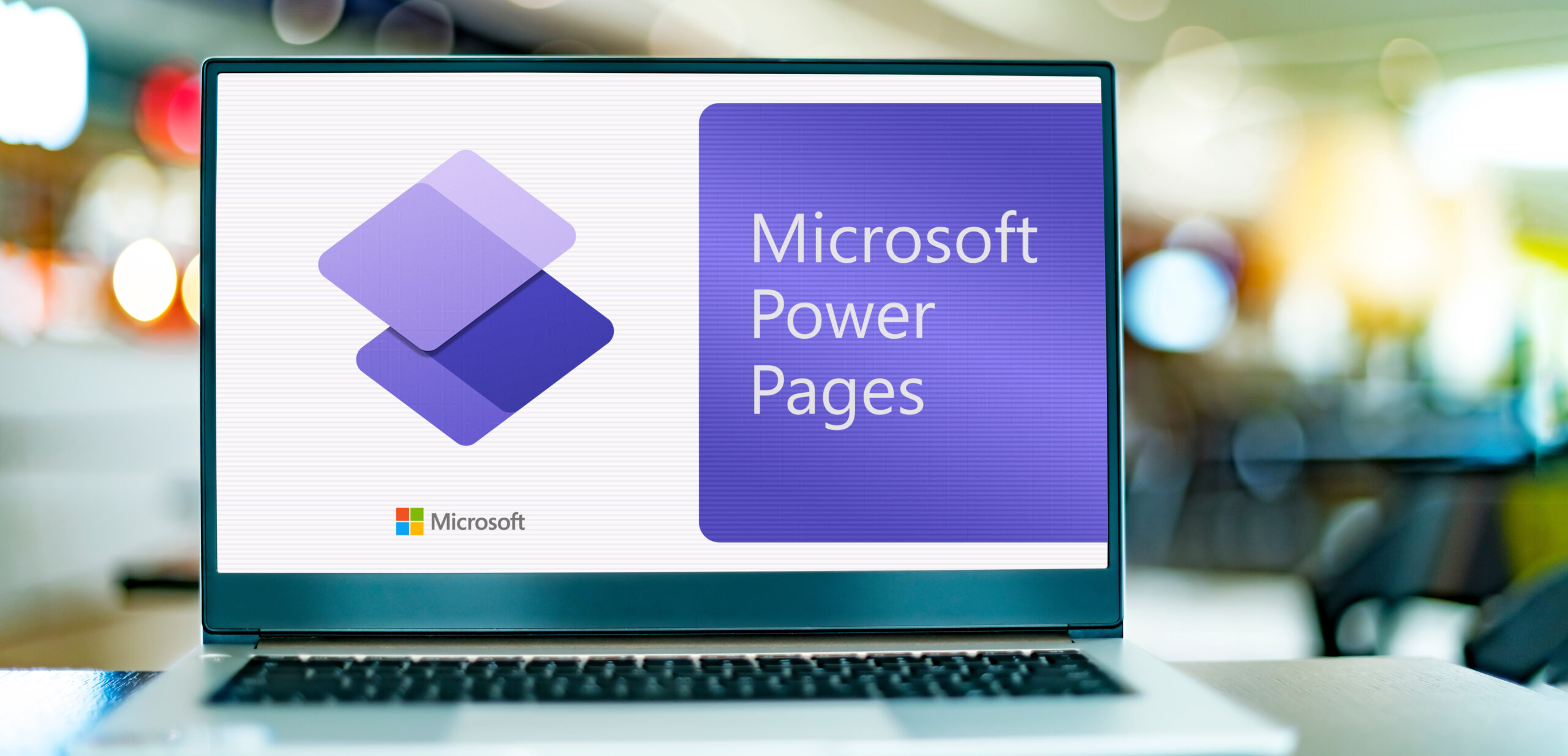 Laptop computer displaying logo of Microsoft Power Pages