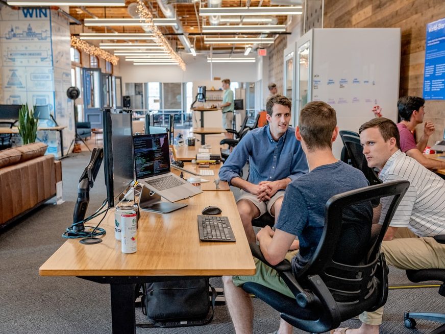 group of men collaborating at office