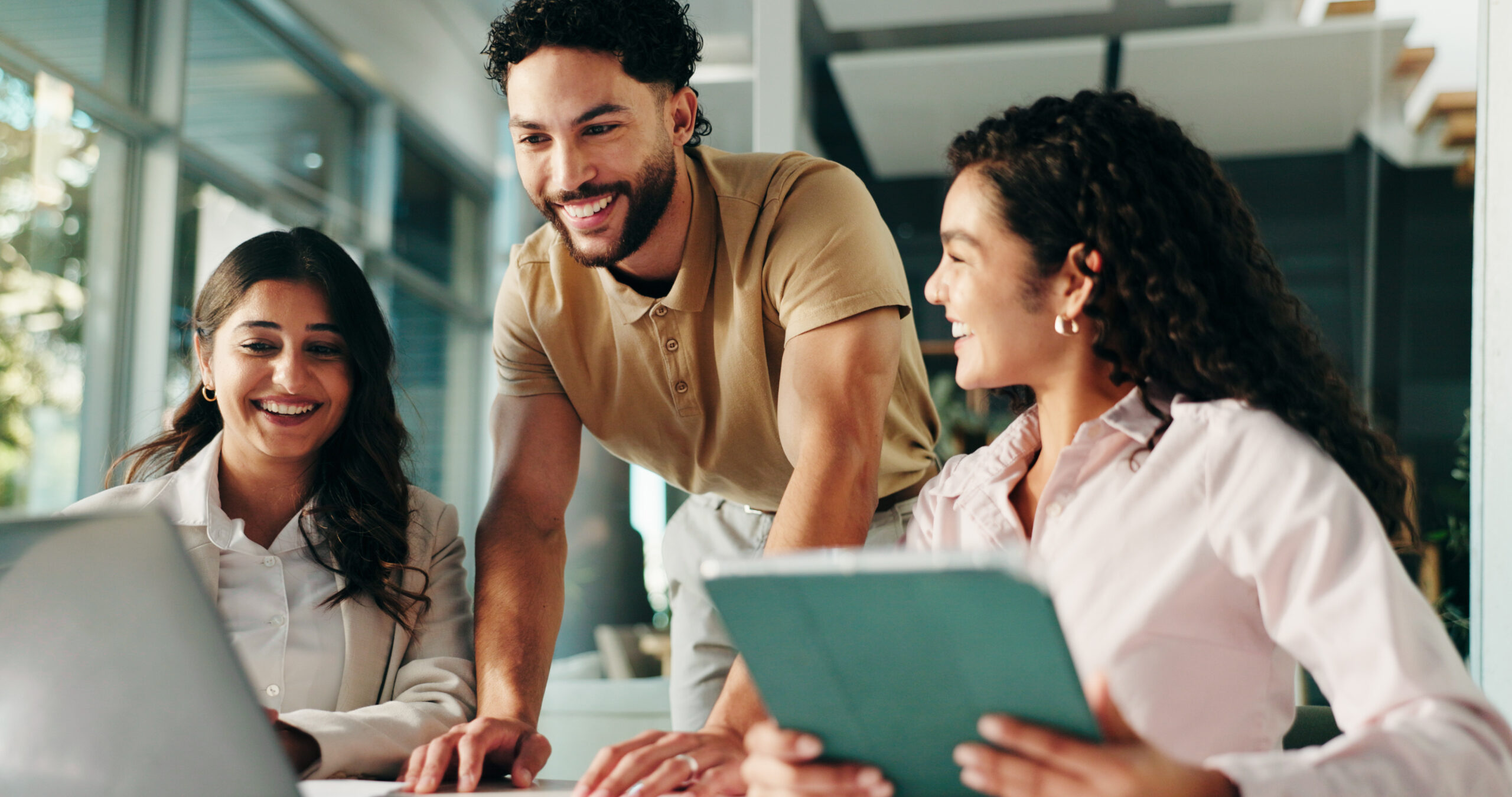 Laughing, meeting and colleagues with tablet, collaboration and humor for project, group and office. Happy, marketing coordinator and people with tech for campaign, teamwork and employees with jokes Intranet Engagement